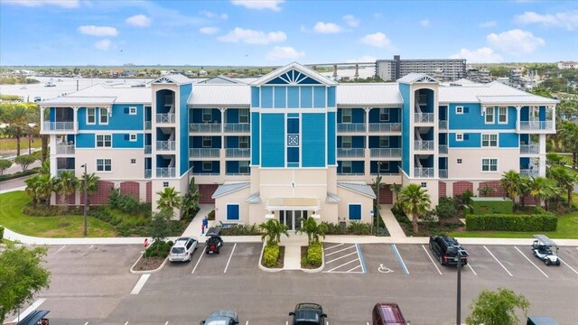 1 Riverwalk Dr Unit 303, New Smyrna Beach, FL 32169 - view of building exterior with uncovered parking