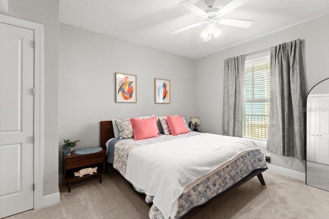 1 Riverwalk Dr Unit 303, New Smyrna Beach, FL 32169 - bedroom with carpet flooring, baseboards, and a ceiling fan