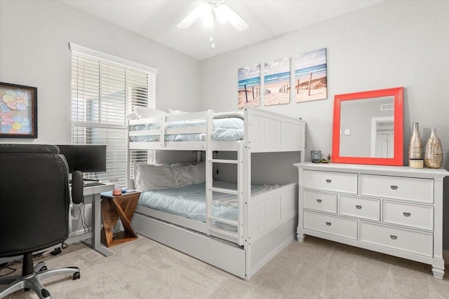 1 Riverwalk Dr Unit 303, New Smyrna Beach, FL 32169 - bedroom featuring light colored carpet, an office area, multiple windows, and a ceiling fan