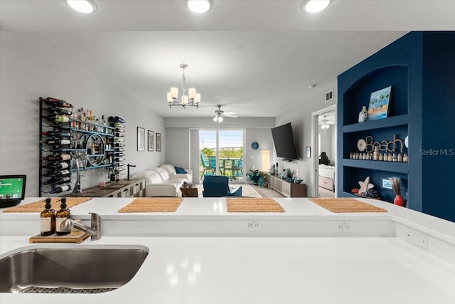 1 Riverwalk Dr Unit 303, New Smyrna Beach, FL 32169 - living room with a chandelier, recessed lighting, and ceiling fan