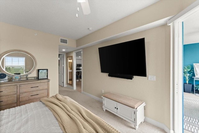 1 Riverwalk Dr Unit 303, New Smyrna Beach, FL 32169 - bedroom with light colored carpet, baseboards, and a ceiling fan
