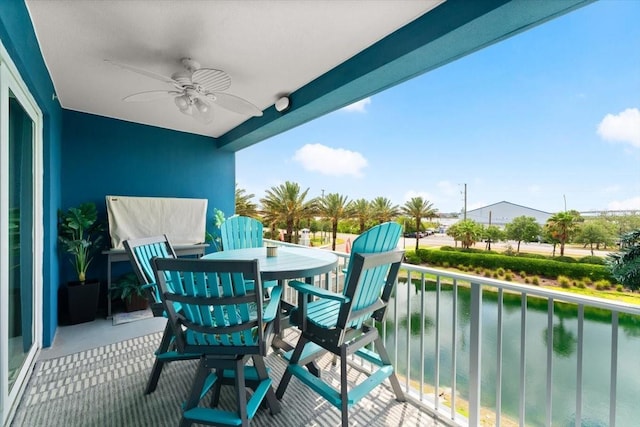 1 Riverwalk Dr Unit 303, New Smyrna Beach, FL 32169 - balcony featuring ceiling fan, a water view, and outdoor dining space