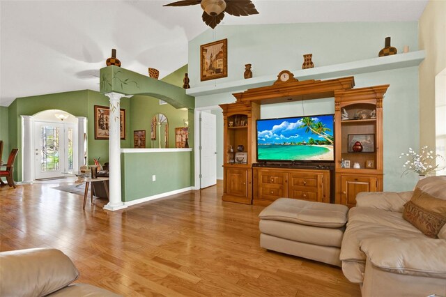 4571 Abaco Dr, Tavares, FL 32778 - living area featuring a ceiling fan, vaulted ceiling, wood finished floors, and ornate columns