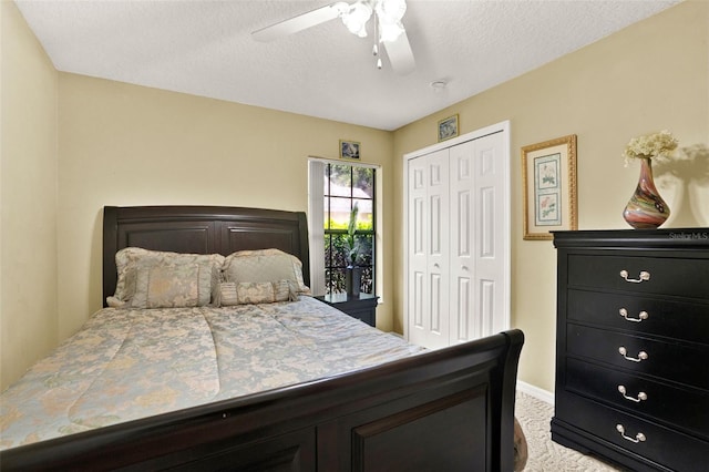 4571 Abaco Dr, Tavares, FL 32778 - carpeted bedroom featuring a closet, a ceiling fan, baseboards, and a textured ceiling