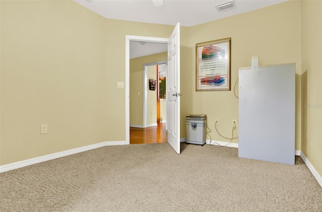 4571 Abaco Dr, Tavares, FL 32778 - unfurnished bedroom with carpet flooring and baseboards