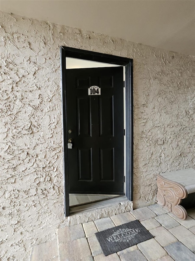 155 N Pearl Lake Cswy Unit 104, Altamonte Springs, FL 32714 - doorway to property featuring stucco siding