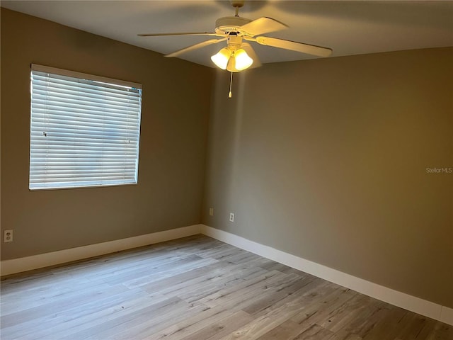 155 N Pearl Lake Cswy Unit 104, Altamonte Springs, FL 32714 - unfurnished room with a ceiling fan, light wood-style flooring, and baseboards