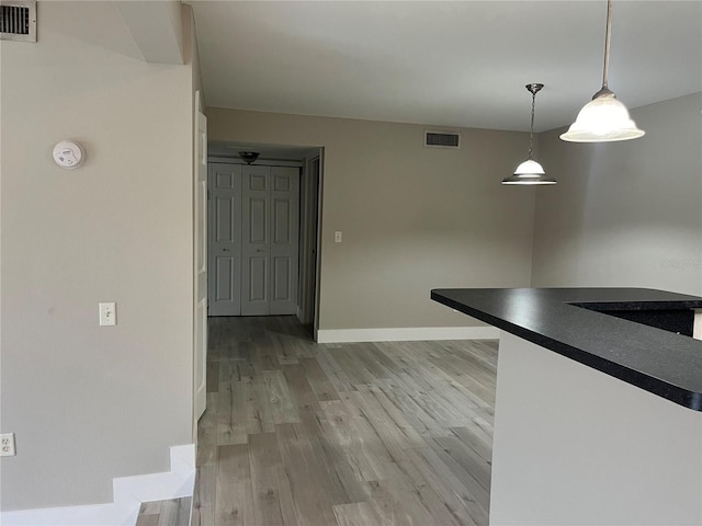 155 N Pearl Lake Cswy Unit 104, Altamonte Springs, FL 32714 - unfurnished dining area featuring light wood-type flooring and baseboards