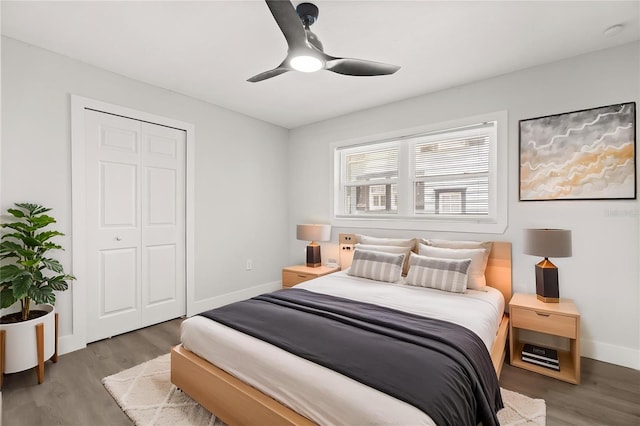 612 Florida Ave, Saint Cloud, FL 34769 - bedroom with wood finished floors, baseboards, a closet, and a ceiling fan