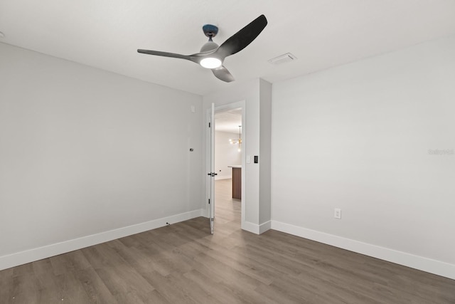 612 Florida Ave, Saint Cloud, FL 34769 - empty room with wood finished floors, a ceiling fan, and baseboards