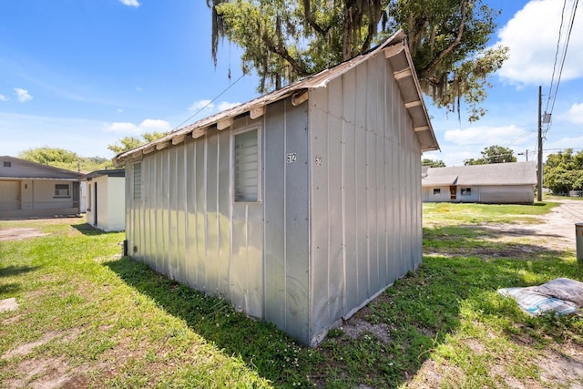 612 Florida Ave, Saint Cloud, FL 34769 - view of side of property featuring a yard and an outbuilding