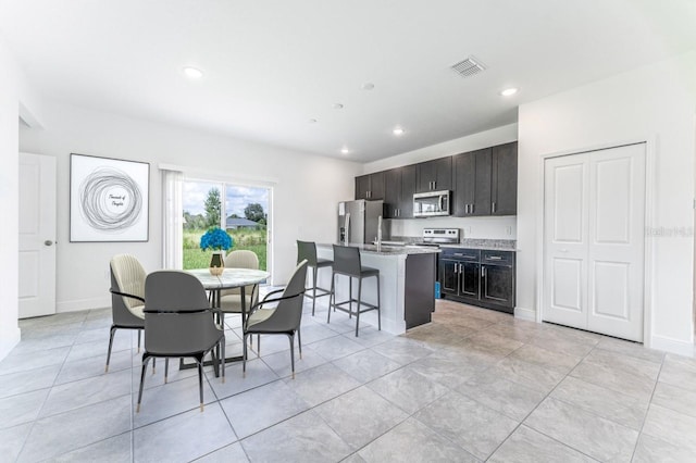3315 W Montgomery Ln, Citrus Springs, FL 34433 - dining area with recessed lighting, baseboards, and light tile patterned floors