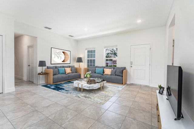 3315 W Montgomery Ln, Citrus Springs, FL 34433 - living room with light tile patterned flooring, recessed lighting, and baseboards