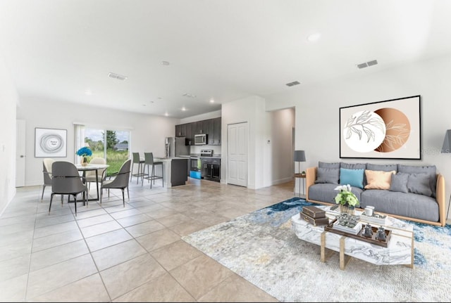 3315 W Montgomery Ln, Citrus Springs, FL 34433 - living area featuring light tile patterned floors and recessed lighting