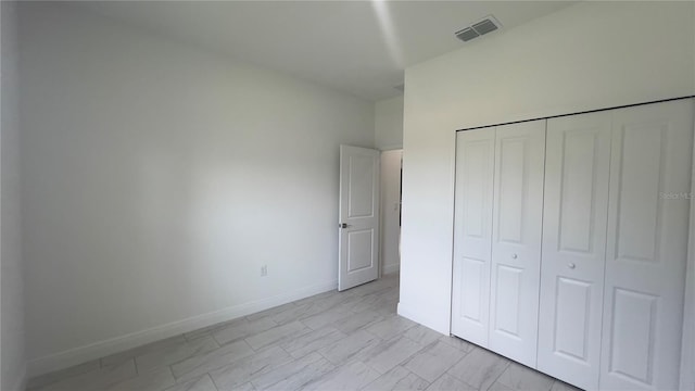 3315 W Montgomery Ln, Citrus Springs, FL 34433 - unfurnished bedroom with a closet and baseboards