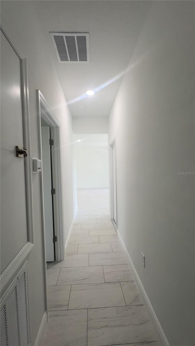 3315 W Montgomery Ln, Citrus Springs, FL 34433 - corridor with light marble finish flooring and baseboards