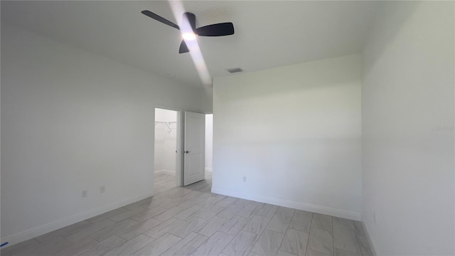 3315 W Montgomery Ln, Citrus Springs, FL 34433 - empty room featuring a ceiling fan and baseboards