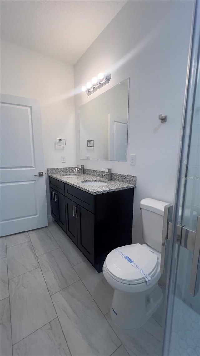 3315 W Montgomery Ln, Citrus Springs, FL 34433 - full bathroom featuring marble look tile flooring, vanity, toilet, and a stall shower