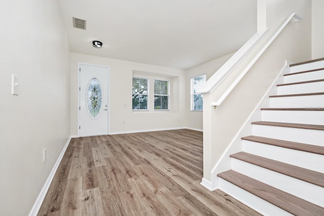 309 Black Springs Ln, Winter Garden, FL 34787 - entrance foyer with wood finished floors, stairs, and baseboards