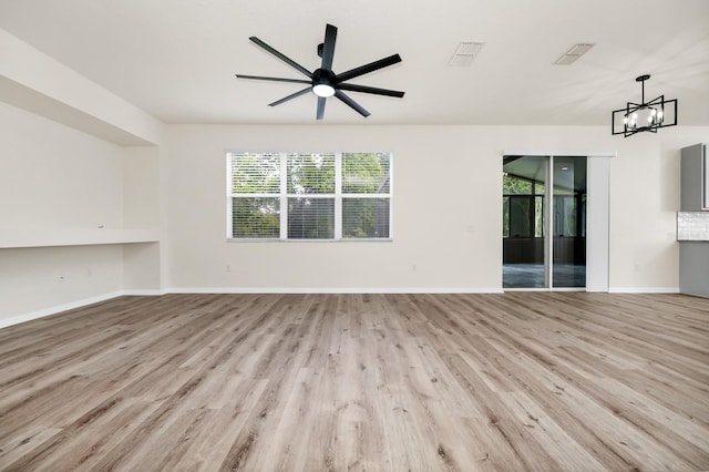 309 Black Springs Ln, Winter Garden, FL 34787 - unfurnished living room with light wood-style floors, ceiling fan, baseboards, and a chandelier