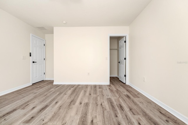 309 Black Springs Ln, Winter Garden, FL 34787 - unfurnished bedroom with light wood finished floors and baseboards