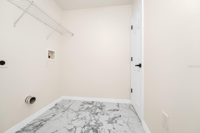 309 Black Springs Ln, Winter Garden, FL 34787 - laundry area featuring light marble finish floors, washer hookup, electric dryer hookup, and baseboards