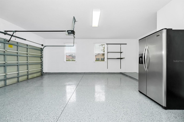 309 Black Springs Ln, Winter Garden, FL 34787 - garage with stainless steel refrigerator with ice dispenser and a garage door opener