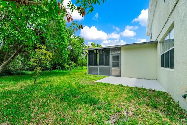309 Black Springs Ln, Winter Garden, FL 34787 - view of green lawn featuring a sunroom and a patio area