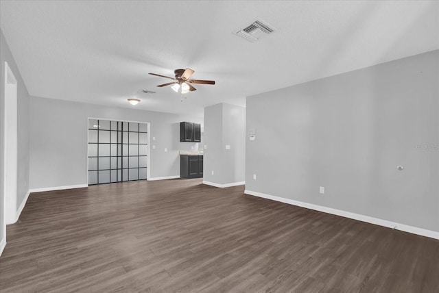2357 E Dana Dr, Deltona, FL 32738 - unfurnished living room featuring a ceiling fan, baseboards, and dark wood-style flooring