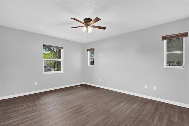 2357 E Dana Dr, Deltona, FL 32738 - unfurnished room with dark wood finished floors, a ceiling fan, baseboards, and a textured ceiling
