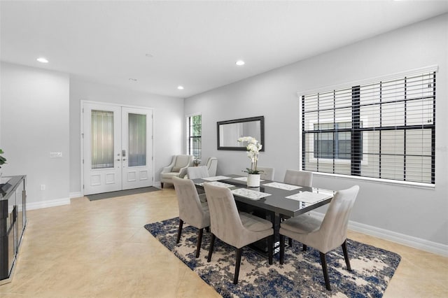 8312 Prestbury Dr, Orlando, FL 32832 - dining room featuring french doors, recessed lighting, light tile patterned flooring, and baseboards