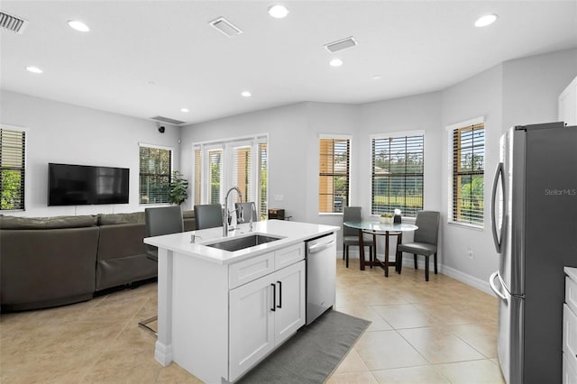 8312 Prestbury Dr, Orlando, FL 32832 - kitchen with appliances with stainless steel finishes, a sink, healthy amount of natural light, recessed lighting, and light tile patterned flooring