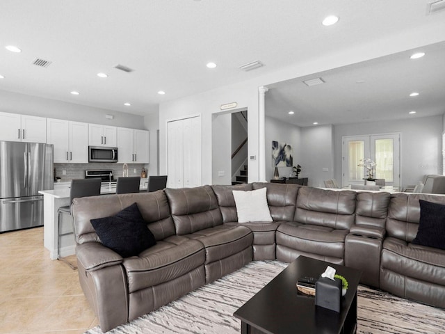 8312 Prestbury Dr, Orlando, FL 32832 - living room featuring stairs, recessed lighting, and light tile patterned floors