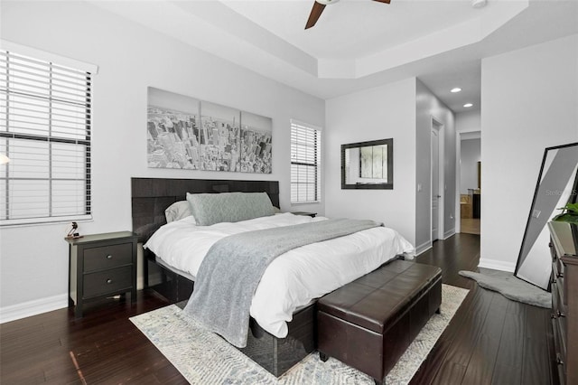 8312 Prestbury Dr, Orlando, FL 32832 - bedroom featuring baseboards, recessed lighting, a tray ceiling, dark wood finished floors, and ceiling fan