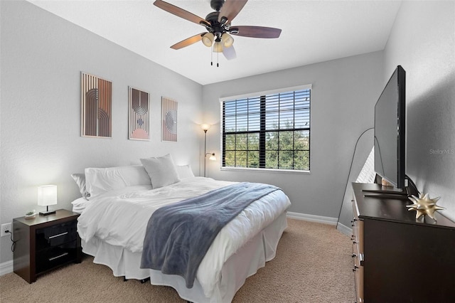 8312 Prestbury Dr, Orlando, FL 32832 - bedroom with baseboards, light colored carpet, and ceiling fan