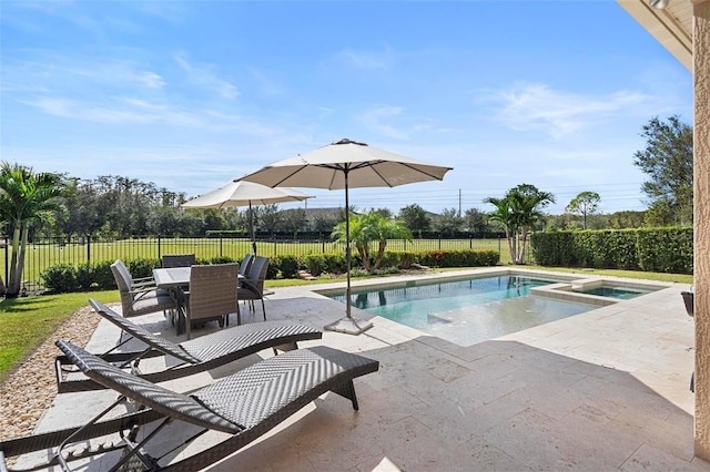 8312 Prestbury Dr, Orlando, FL 32832 - view of swimming pool featuring a patio, a fenced backyard, outdoor dining area, and a pool with connected hot tub