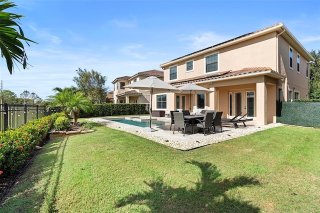 8312 Prestbury Dr, Orlando, FL 32832 - rear view of house with stucco siding, a patio, and a tiled roof