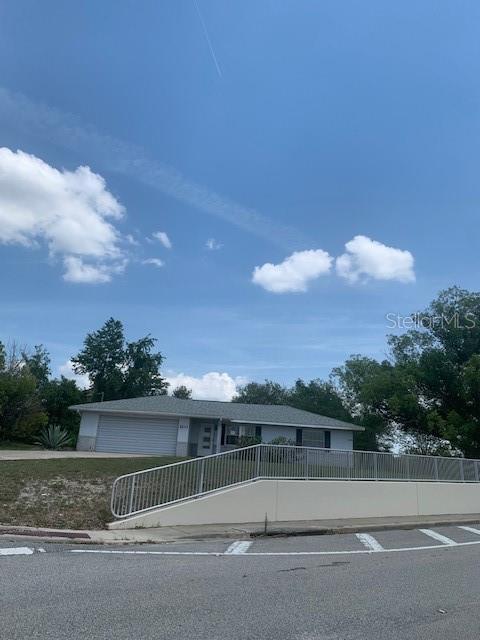 2233 N Normandy Blvd, Deltona, FL 32725 - view of front of property with a fenced front yard and an attached garage