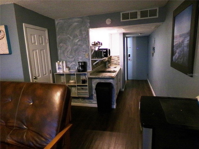 219 S Atlantic Ave Unit 436, Daytona Beach, FL 32118 - interior space featuring dark wood-type flooring and black microwave