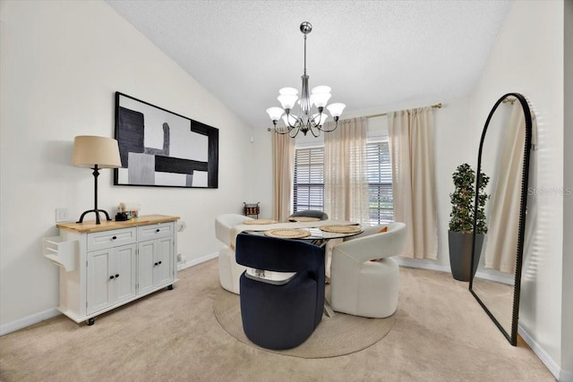 2900 Hammock Dr, Plant City, FL 33566 - dining space featuring light colored carpet, a chandelier, a textured ceiling, and vaulted ceiling