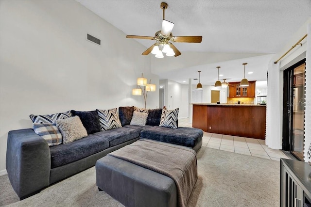 2900 Hammock Dr, Plant City, FL 33566 - living area with lofted ceiling, light colored carpet, ceiling fan, and light tile patterned floors