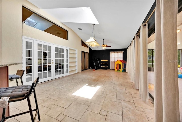 2900 Hammock Dr, Plant City, FL 33566 - unfurnished sunroom featuring french doors, vaulted ceiling, and a skylight