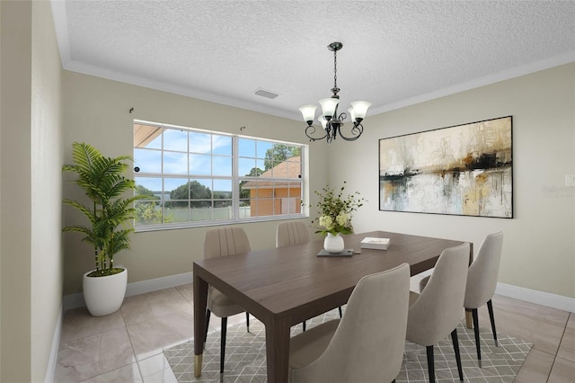 181 W Minnehaha Ave, Clermont, FL 34711 - dining space with a chandelier, baseboards, a textured ceiling, and ornamental molding