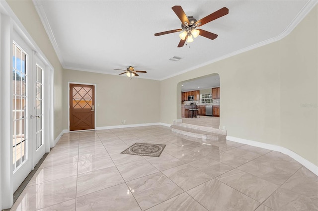 181 W Minnehaha Ave, Clermont, FL 34711 - unfurnished room with arched walkways, crown molding, ceiling fan, baseboards, and french doors