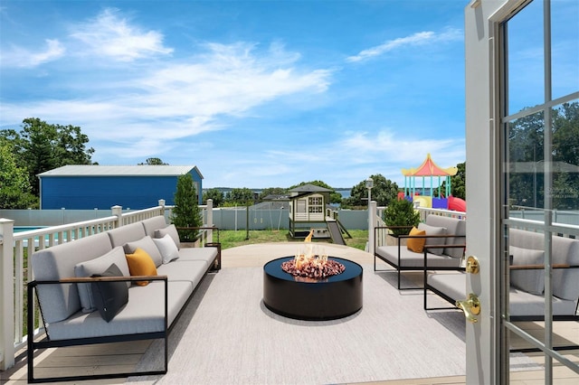 181 W Minnehaha Ave, Clermont, FL 34711 - view of patio / terrace featuring an outdoor living space with a fire pit