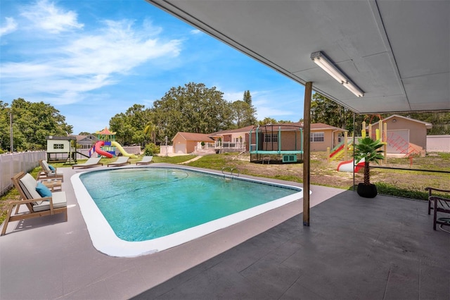 181 W Minnehaha Ave, Clermont, FL 34711 - view of swimming pool with a playground, a trampoline, and a patio area