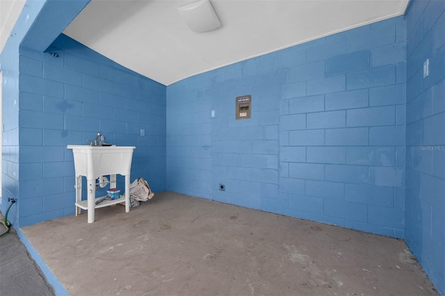 181 W Minnehaha Ave, Clermont, FL 34711 - exterior space with unfinished concrete flooring, concrete block wall, and vaulted ceiling