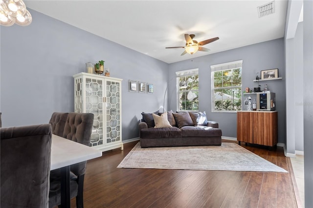 2762 Pepper Ln, Orlando, FL 32812 - living room with a ceiling fan, dark wood-style flooring, and baseboards