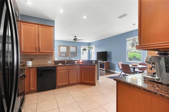 2762 Pepper Ln, Orlando, FL 32812 - kitchen featuring black appliances, a sink, a peninsula, healthy amount of natural light, and recessed lighting