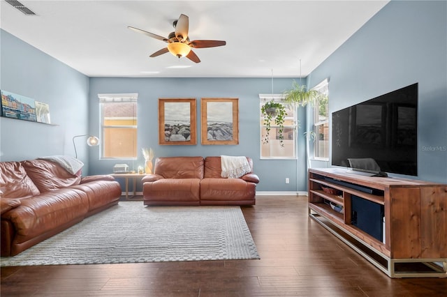 2762 Pepper Ln, Orlando, FL 32812 - living room featuring plenty of natural light, ceiling fan, and dark wood-style flooring